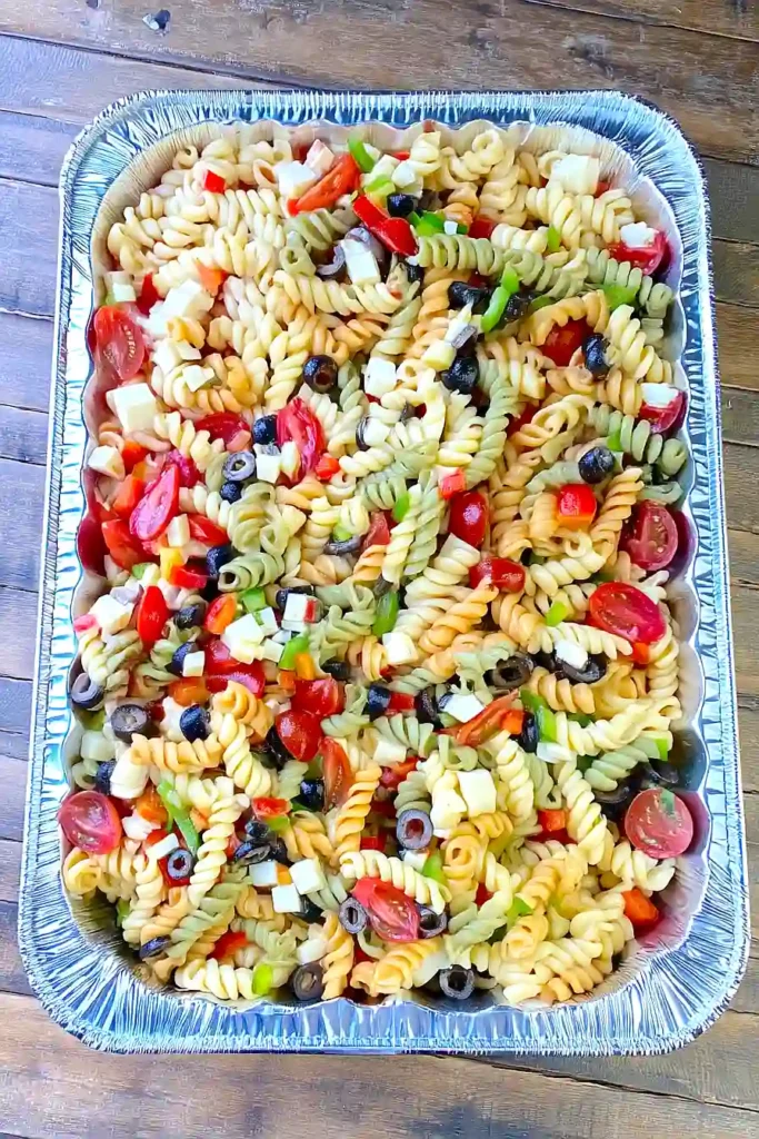Tri colored rotini pasta salad with cherry tomatoes