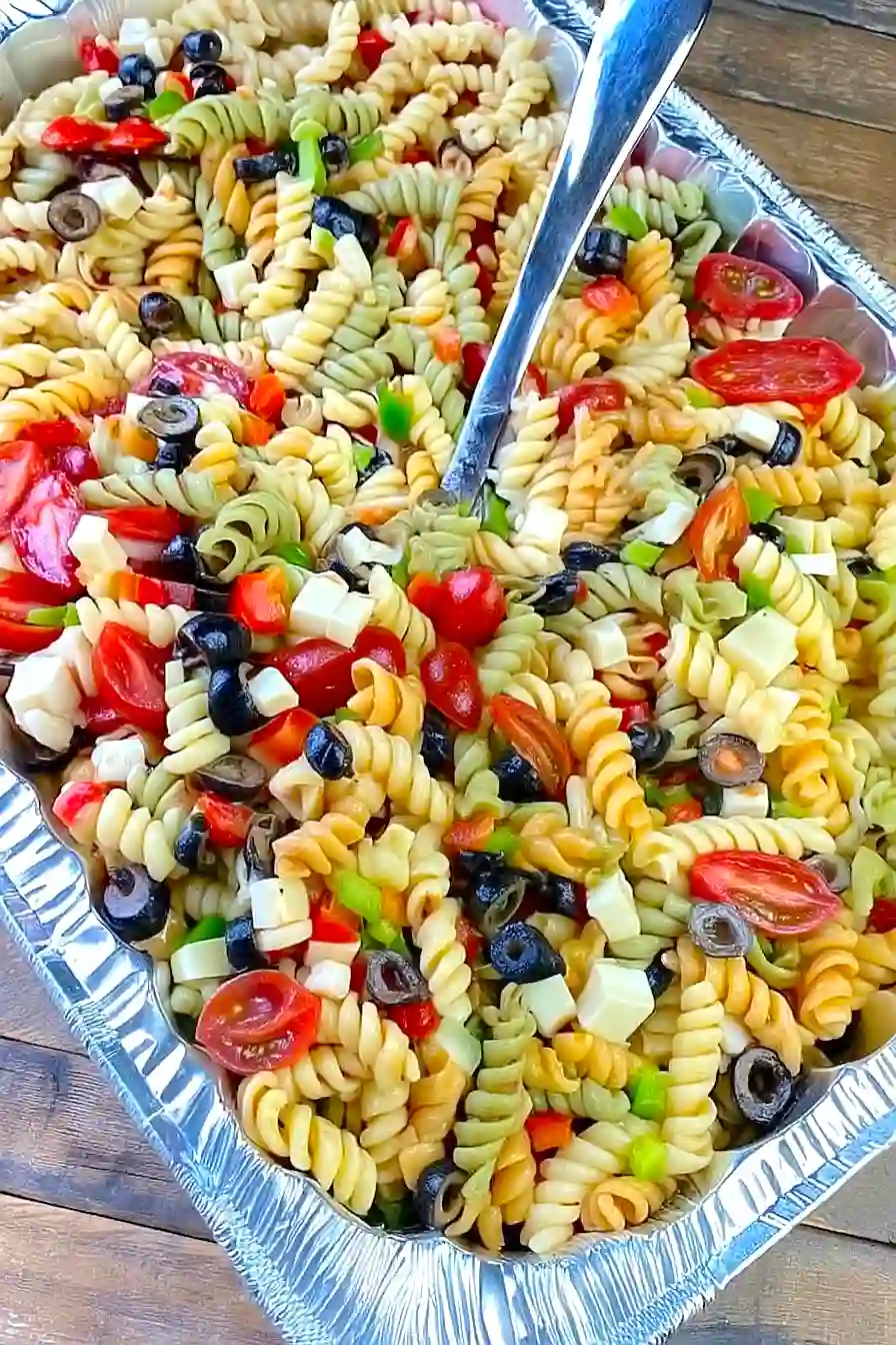 Tri colored rotini pasta salad with cherry tomatoes